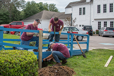 Project Unite photo of volunteers working on a wheelchair ramp