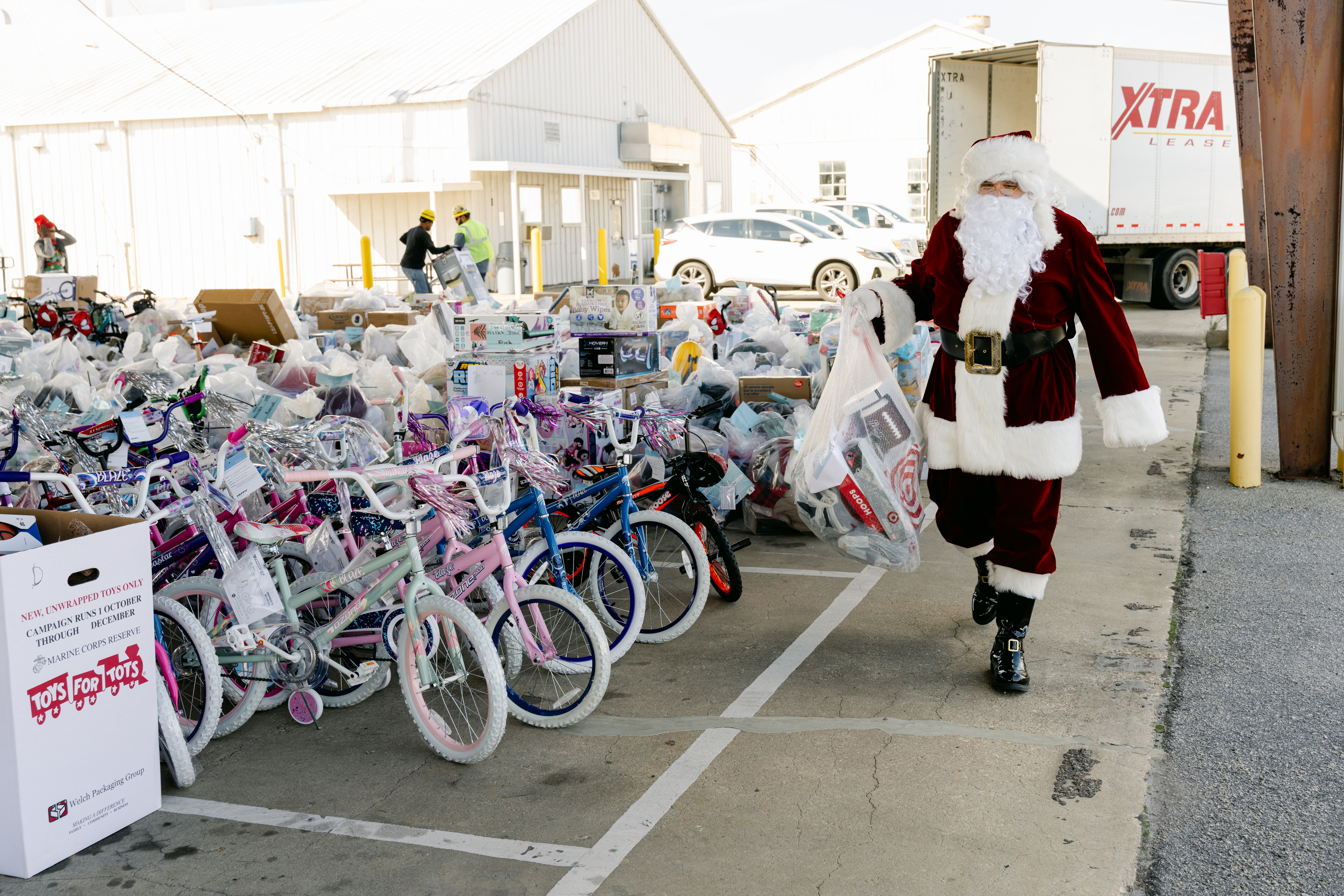 Santa observing the bikes collected in 2024 for the Toys for Tots campaign