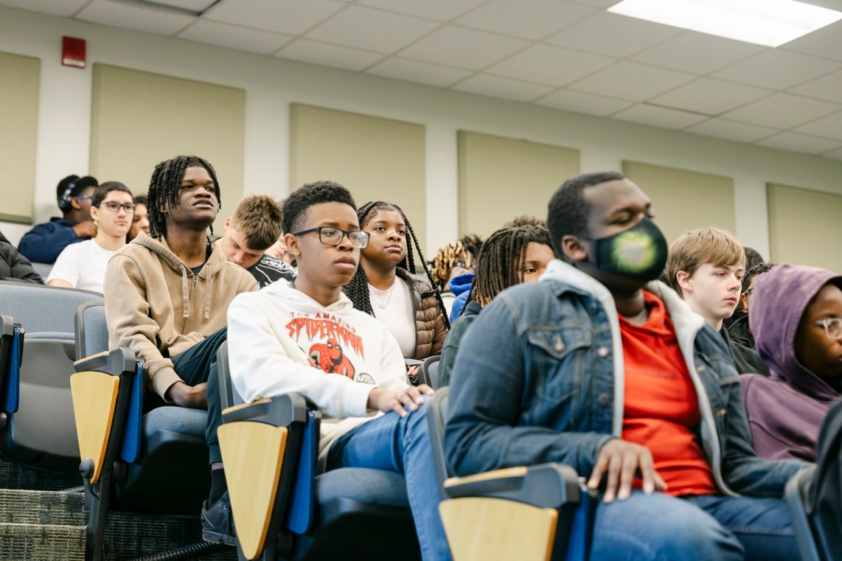 RCTCM Cyber Academy of Excellence students listen to SRNS panelists during the reveal.