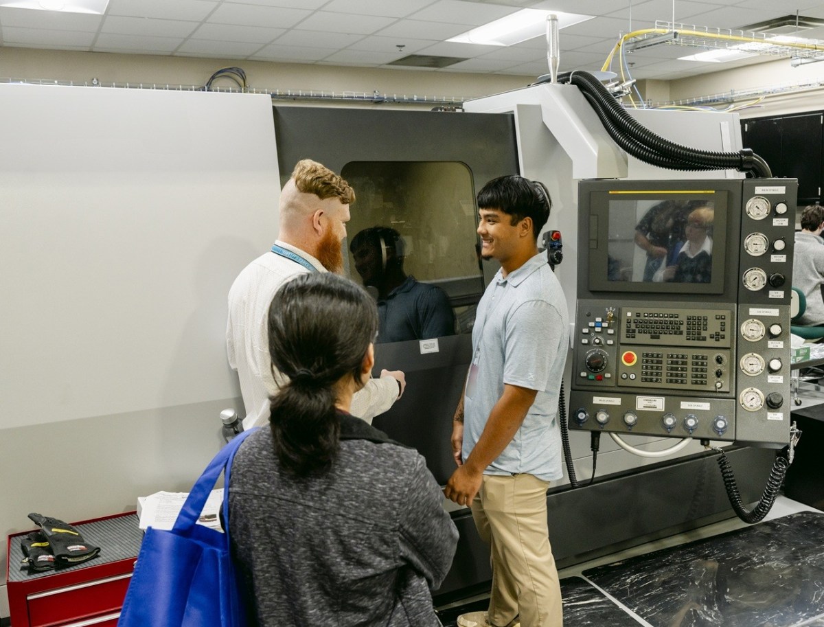 A WORC grant recipient views a high-precision lathe which is responsible for disassembling welding items.