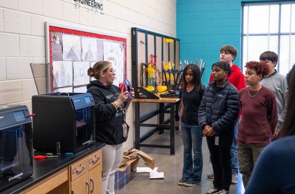 A.R. Johnson Educator Ashley Exantus shows her class how to add new filament to one of two 3D printers purchased using SRNS Innovative Teaching Mini Grant funding.