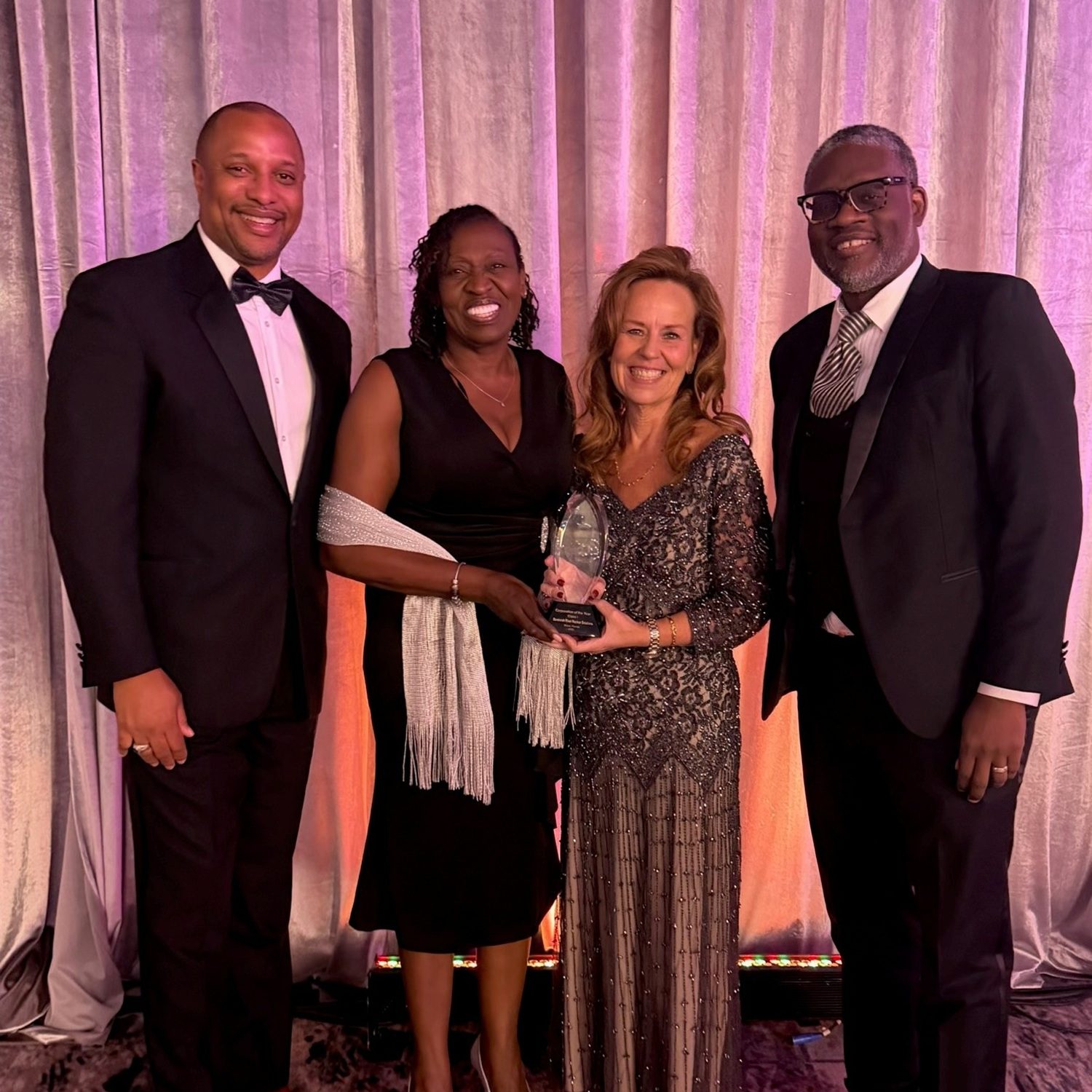 Jay Johnson, Deputy Senior Vice President, Business Services and Chief Contracting Officer; Tyler; Tanner; and Alex Agyemang, Senior Deputy Director, Supply Chain Management during the National Minority Supplier Development Council Awards Gala.
