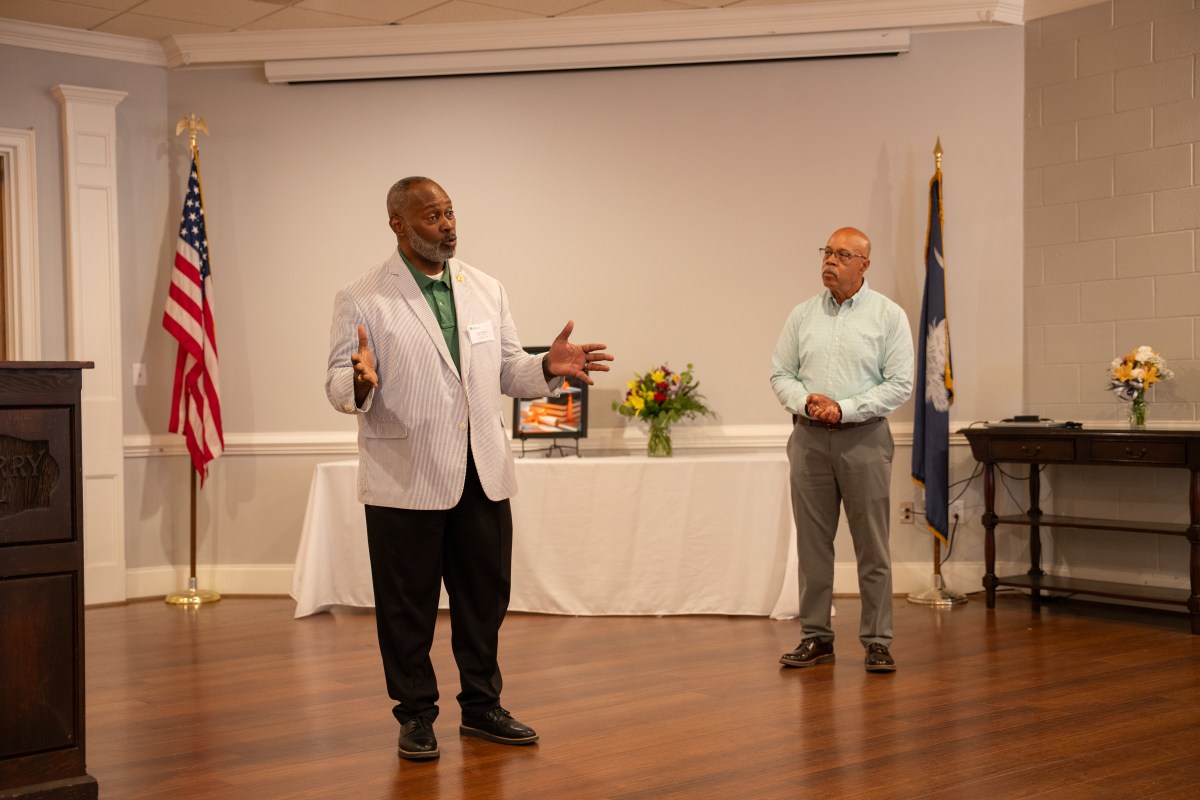 Sean Alford (left) addresses attendees during the SRNS Family Scholarship Awards Ceremony, highlighting the program’s impact and recognizing the accomplishments of this year’s scholarship recipients.